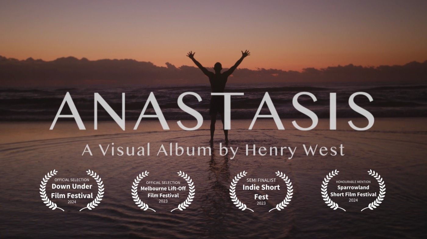 ANASTASIS: A Visual Album by Henry West. A figure stands in shallow water at dawn, arms raised.